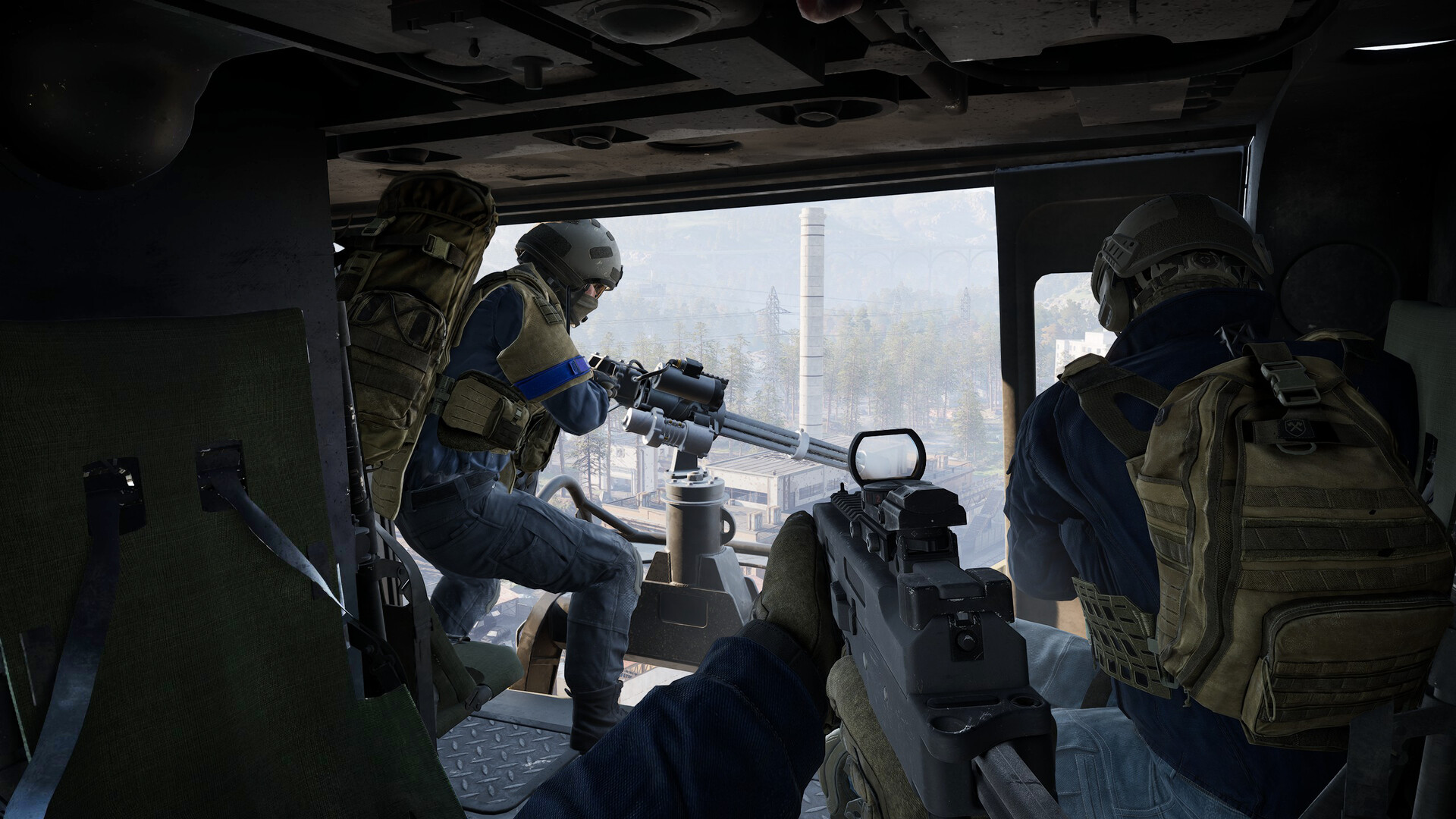 Official WARDOGS Steam screenshot showing soldiers inside a helicopter with a minigun overlooking an industrial battlefield